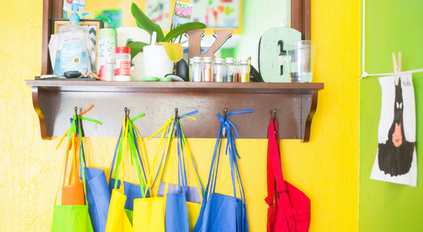 nursery school aprons hanging to illustrate trauma informed nursery care training.